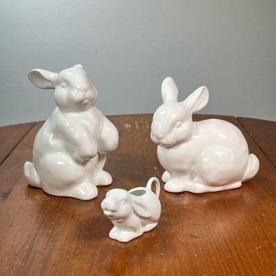 (3PC) CERAMIC BUNNY RABBITS | Decorative white rabbit figures, including a matching couple and a single gravy pitcher/creamer. - l. 7 x...