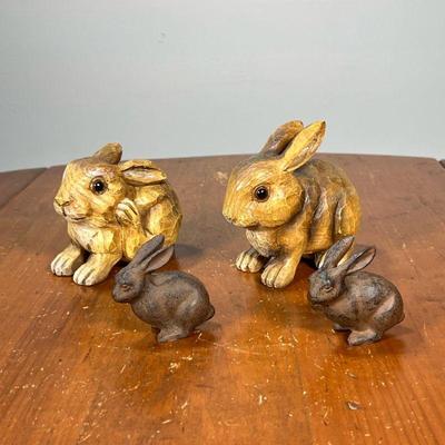 FOUR BUNNY RABBITS | Including a pair of carved wood rabbit figures and a pair of painted metal rabbits. - l. 5 x w. 3 x h. 4-1/2 in

