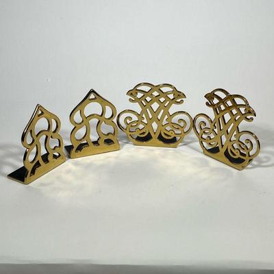 TWO PAIRS OF BRASS BOOKENDS | Two pairs of bookends one pair marked Monticello, the other pair marked Thomas Jefferson cipher. - l. 6 x...