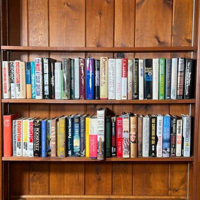 LOT OF BOOKS | Two shelves full of books. Genre varies between history fiction science sports fantasy, etc., mostly hardcovers.

