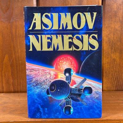 FIRST EDITION OF NEMESIS BY ISAAC ASIMOV | First edition science fiction novel by Isaac Asimov, hardcover book with dust jacket. - l....