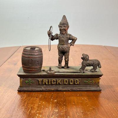 ANTIQUE CAST IRON TRICK DOG MECHANICAL BANK | l. 8-1/2 x w. 3 x h. 7-1/4 in


