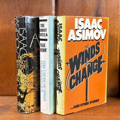 THREE SCI-FI BOOKS BY ISAAC ASIMOV | Mid-century science fiction books, including: The Robot Novels (The Caves of Steel, The Naked Son),...