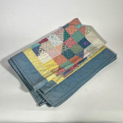 COLORFUL QUILT | Composed of multiple floral and colorful fabrics with diamond patterns. - l. 53 x w. 39 in

