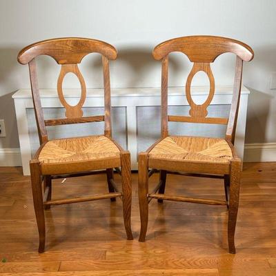 PAIR POTTERY BARN NAPOLEON CHAIRS | Two pottery barn side chairs with shaped wood backs and rush seats. - l. 18-1/2 x w. 19 x h. 37 in

