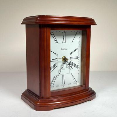 BULOVA WESTMINSTER MELODY CLOCK | Bulova music clock in cherry wood case, plays Westminster Melody. - l. 8.75 x w. 5.25 x h. 10 in

