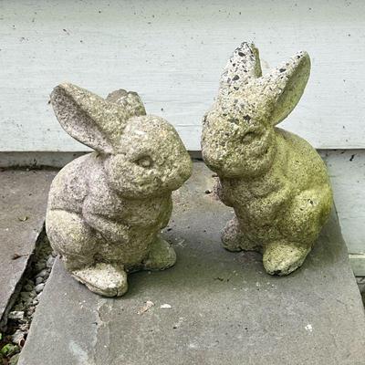 (2PC) PAIR CONCRETE RABBITS | Pair of concrete rabbit form garden sculptures. - l. 6.5 x w. 5 x h. 8.5 in

