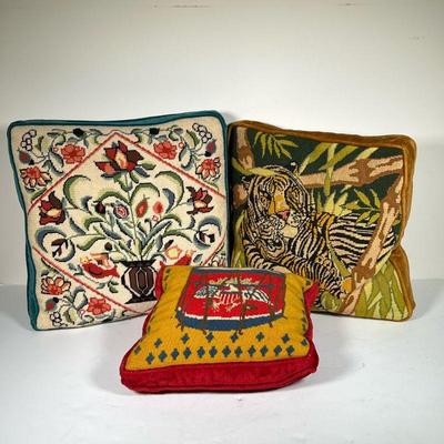 (3PC) NEEDLEPOINT PILLOWS | Including a pillow depicting an Americana drum with eagle, a tiger in the jungle, and flowers in a vase. - l....