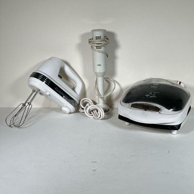 (3PC) KITCHEN TOOLS | Small kitchen tools including a Cuisinart hand mixer, a George Forman grilling machine, and a Braun mixer or...