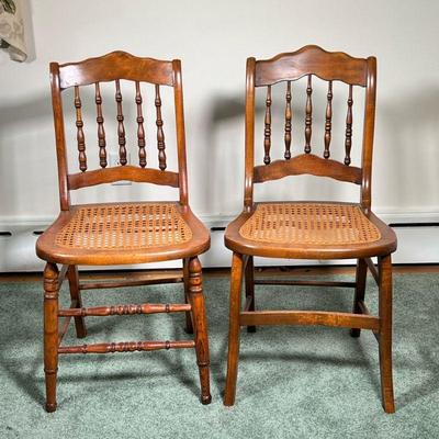 (2PC) CANE CHAIRS | Similar wooden side chairs having turned spindle back with caned seat and turned wood legs & stretchers. - l....