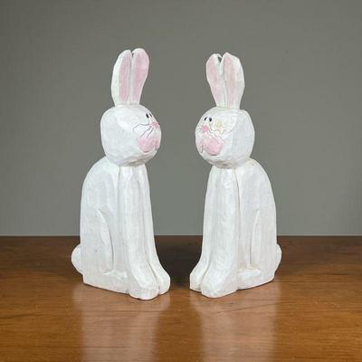 EDDIE WALKER BUNNY RABBITS | Two wooden carved and painted bunny rabbit figures by Eddie Walker. - l. 5-1/2 x w. 2 x h. 11 in

