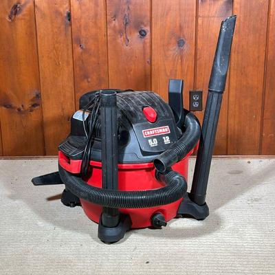CRAFTSMAN 12-GALLON VACUUM | 12-gallon craftsman shop vac with accessories. - l. 24 x w. 22 x h. 20 in

