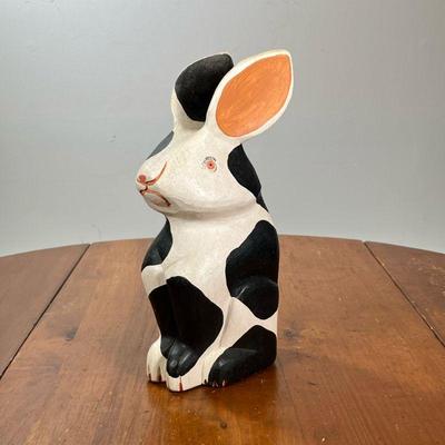 CARVED WOOD BUNNY | Black and white spotted carved and hand-painted rabbit figure. - l. 5-1/2 x w. 4 x h. 12-1/4 in

