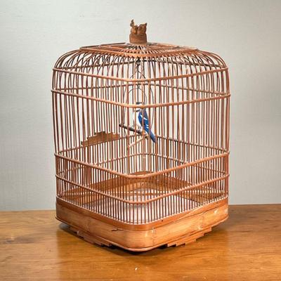 VINTAGE BIRDCAGE WITH BLUE JAY | Wooden bird cage with a painted wood blue jay inside. - l. 11-1/2 x w. 11-1/2 x h. 17 in

