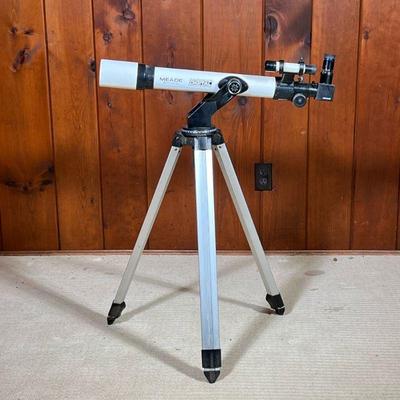 MEADE TELESCOPE | Meade multi-coated electronic digital series telescope with tripod and attachments. - l. 28 x w. 7 x h. 48 in

