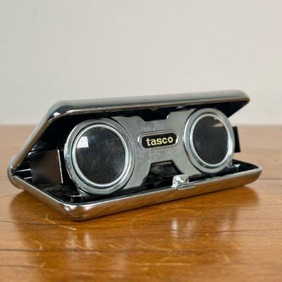 VINTAGE TASCO SPORT FOLDING BINOCULARS | Tasco foldable binoculars in good condition with some glue residue. - l. 4-1/2 x w. 2-1/2 x h. 2...