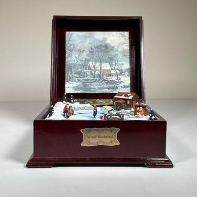 WINTER WONDERLAND MUSIC BOX | Mr. Christmas “Winter Wonderland” music box showing figures ice skating, skiing, and more. - l. 7.5 x w....