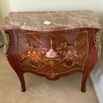 There's an abundance of marble top furniture.