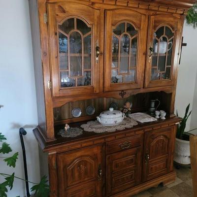 A hutch filled with beautiful dishes