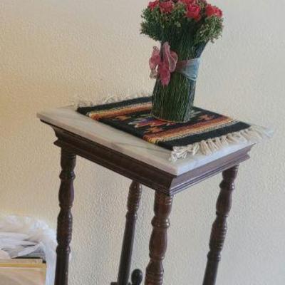 One of many marble top side tables