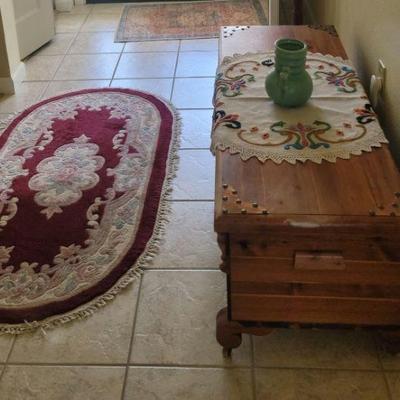 all wood hope chest and many Victorian type area rugs