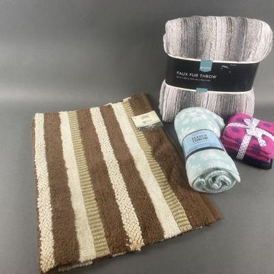 Lot 19 | New Throws, Washcloths & Rug
