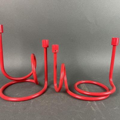 Lot 379 | Paola Navone Red Enamel Twist Candleholders
