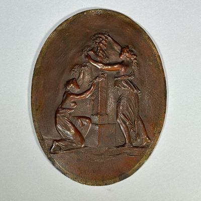 BRONZE BAS RELIEF PLAQUE | 19th century, showing two female figures placing a garland around a bust of a satyr Marked P & S and...