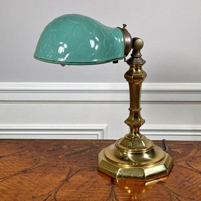 BRASS & CERAMIC DESK LAMP | Green ceramic lampshade with a scale or artichoke pattern mounted on an articulating octagonal brass...