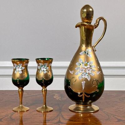BLOWN GREEN GLASS DECANTER & GLASSES | Hand blown green glass decanter and pair of cordials with gilt base and floral accent. -

