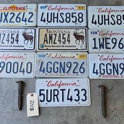 #2156 • 10 License Plates and 2 Railroad Spikes

