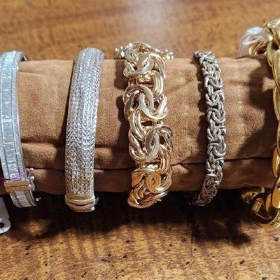 Costume, sterling and gold bracelets.