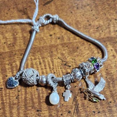 Judith Ripka charm bracelet and other charms.