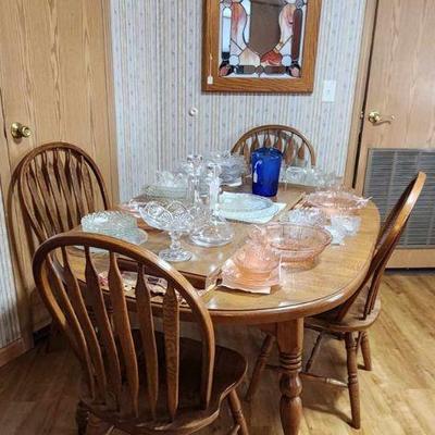 Nice table with 4 chairs and 1 leaf. 