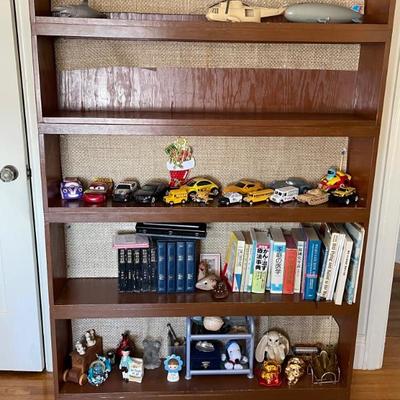 bookshelf with vintage toys 