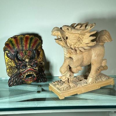 WOOD CARVED DRAGONS | Including; carved wood dragon/horse figurine and colorful wood carved and painted dragon mask. - l. 14 x w. 5 x h....