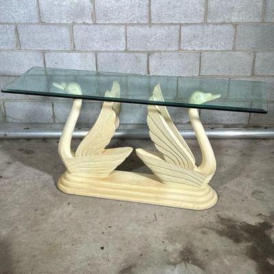 SWAN TABLE | Having beveled glass top over a pair of carved swans. - l. 60 x w. 18 x h. 29.5 in


