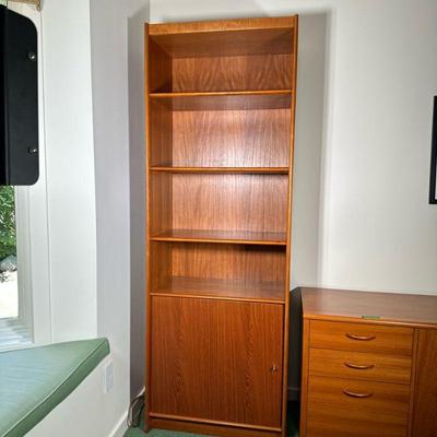 TEAK BOOKSHELF | Having 4 shelves over 2 shelf cabinet. - l. 27.5 x w. 16 x h. 78.5 in

