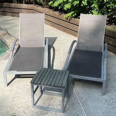(3PC) PAIR OUTDOOR LOUNGERS | Having curved metal frame with adjustable back and matching slatted table. - l. 75 x w. 26.75 x h. 36 in

