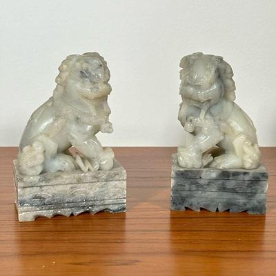 CARVED STONE LION BOOKENDS | Carved stone lion-form bookends. - l. 3 x w. 2 x h. 5.25 in

