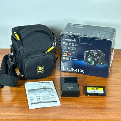 PANASONIC FZ 200 CAMERA | Panasonic LUMIX DMC-FZ 200 camera in original box with Ruggard camera bag.

