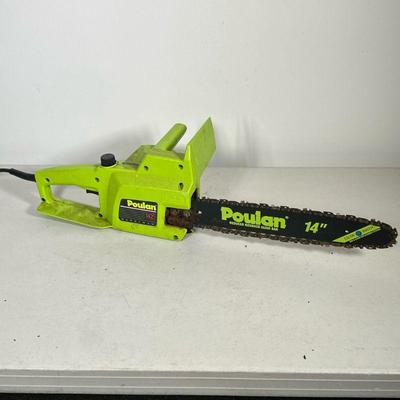 POULAN ELECTRIC CHAINSAW | Poulan corded electric chainsaw with 14” bar, Model no. 1425. - l. 27 x w. 8 x h. 8 in

