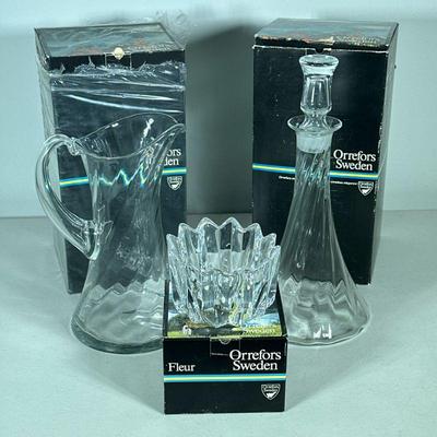 (3PC) ORREFORS CUT CRYSTAL | Including; Helena Decanter, Helena Pitcher, and Fleur cut crystal bowl. - l. 6.5 x w. 6.5 x h. 12.5 in

