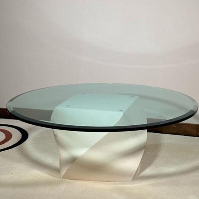 ROUND GLASS COFFEE TABLE | Circular beveled glass coffee table on a twisted plastic base. - h. 15.5 x dia. 42 in

