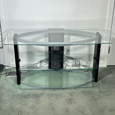 BELL’O GLASS TV STAND | Glass and metal TV stand having 3 shelves and cable management in back. - l. 44.5 x w. 21.5 x h. 24 in


