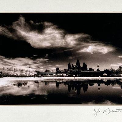 JOHN MCDERMOTT SIGNED PHOTOGRAPH | Angkor Watt. Photograph. 5 x 7 in. sight. Signed lower right, part of a series by John McDermott on...