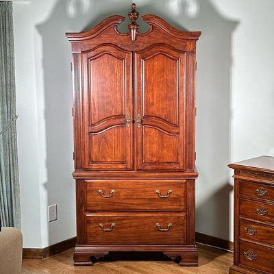 CARVED WOOD ARMOIRE | Having large finial on top with fluted sides over large double door cabinet and 2 full-width drawers with brass...