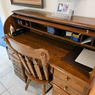 This is a wooden roll top desk