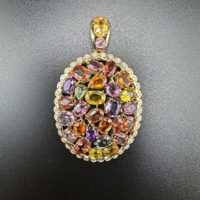 Sapphire and diamond pendant on 14k gold setting