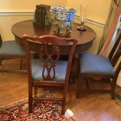 $1495-Formidable table with 4 chairs and 8 leaves each 8 inches-without leaves 30"H 47"diameter